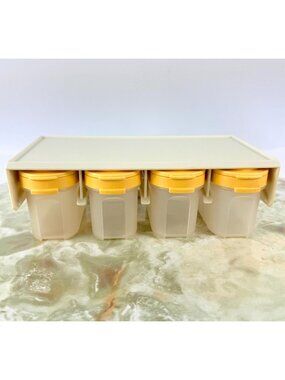 Vintage 80s Tupperware, set of 4 yellow Modular Mate spice shakers, with holder